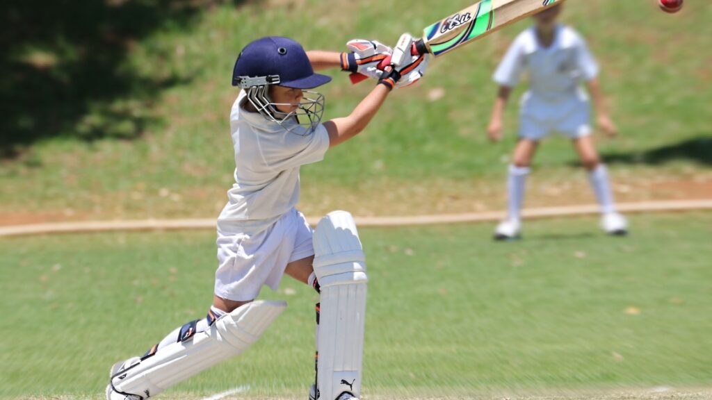 boy playing cricket